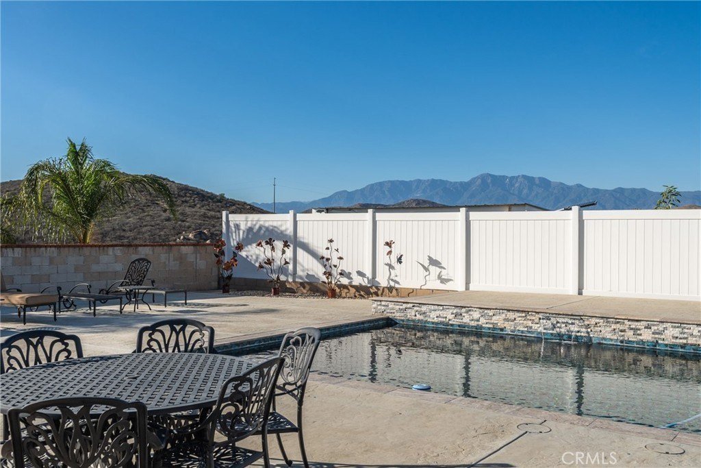 Backyard pool with mountain views